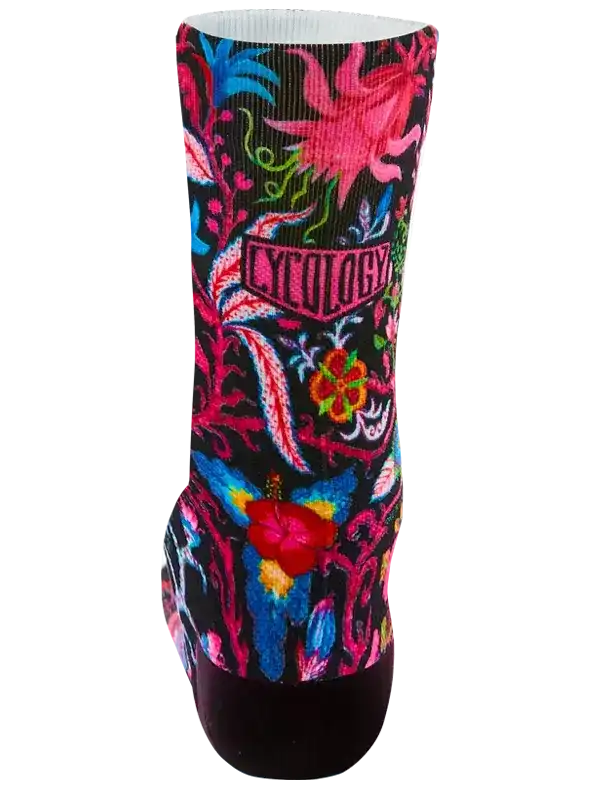 Vibrant floral cycling sock with bold pink, blue, and red patterns, featuring 'CYCOLOGY' logo on black background