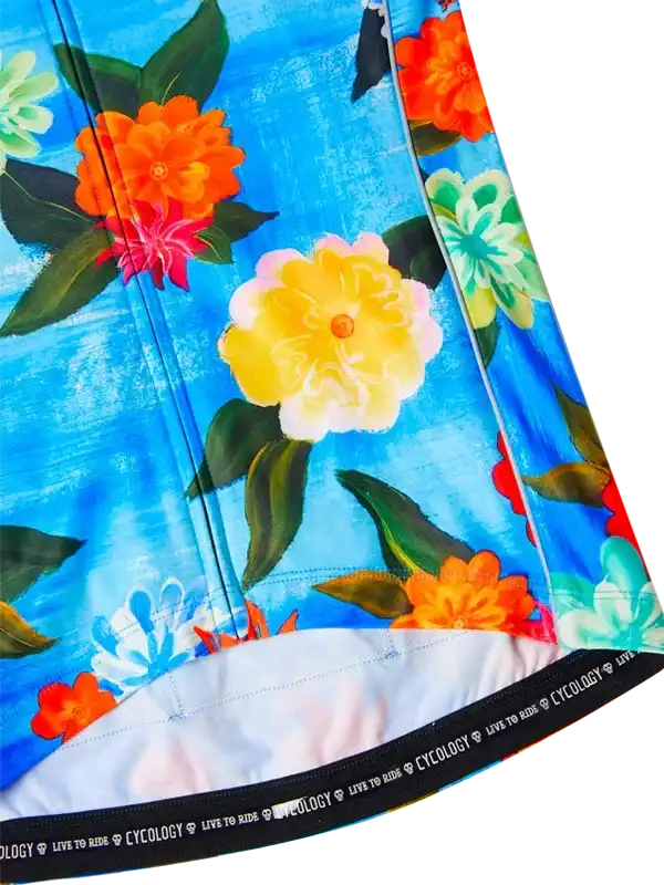 Vibrant floral cycling shorts with blue background and colorful blooms for active rides