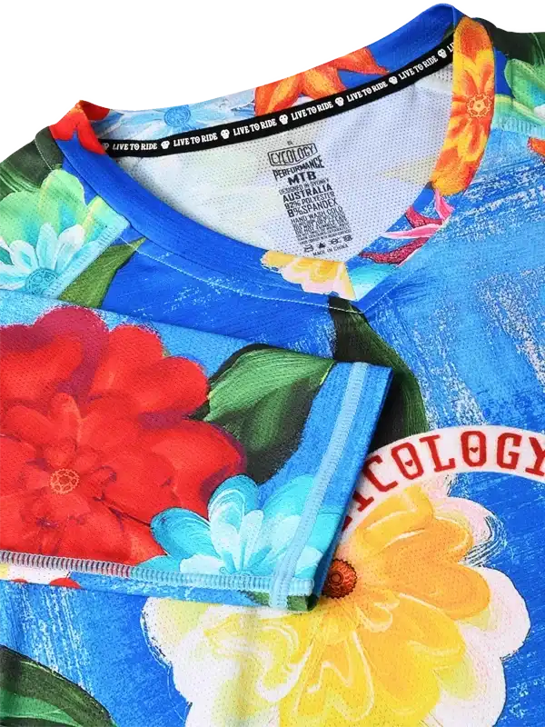 Vibrant floral cycling jersey with bold colors and 'Live to Ride' tagline, ideal for MTB enthusiasts.