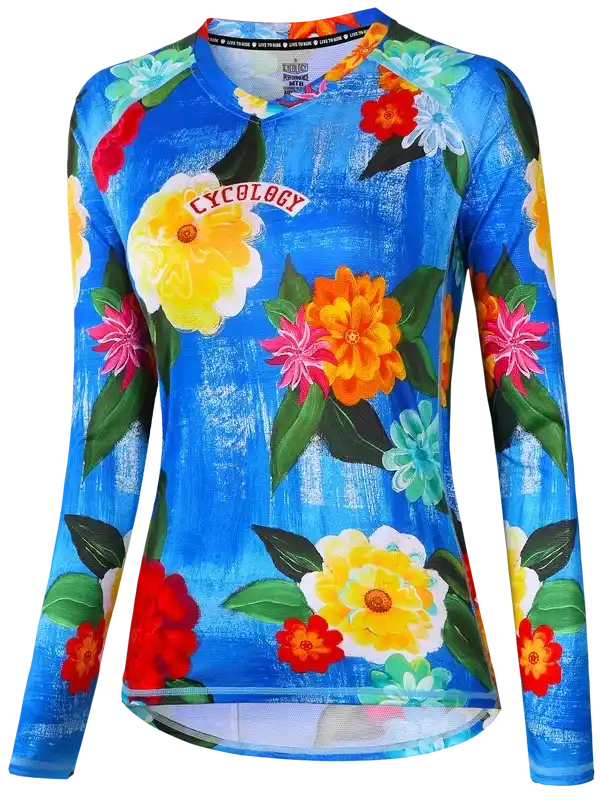 Women's long sleeve cycling jersey with vibrant floral print on blue background, ideal for road or mountain biking.