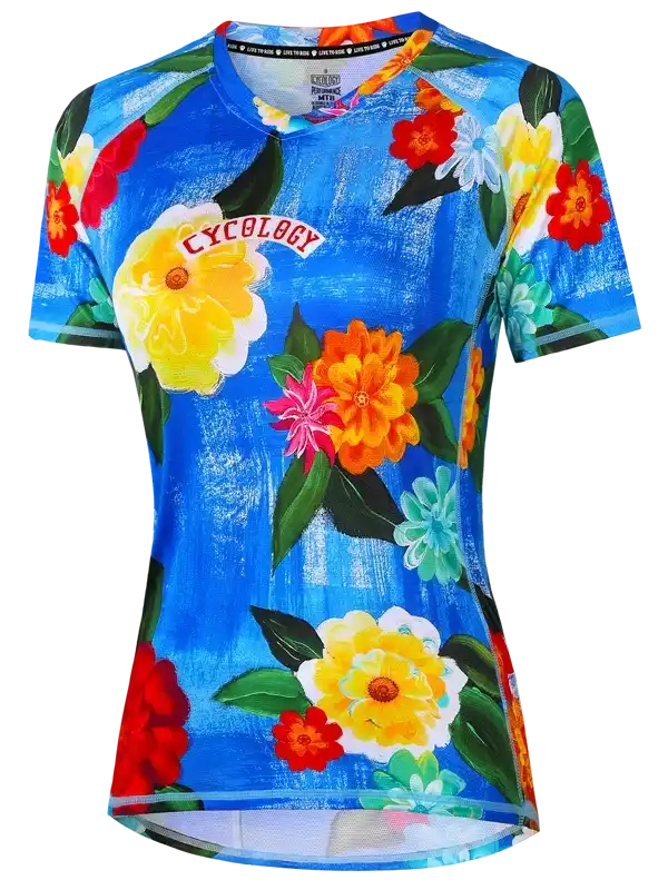 Women's cycling jersey with vibrant floral print on blue background, featuring 'CYCOLOGY' logo