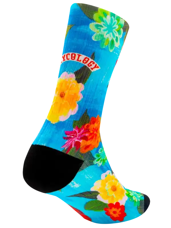 Vibrant floral cycling sock with blue background and black toe, featuring colorful flowers and 'CYCOLOGY' text.