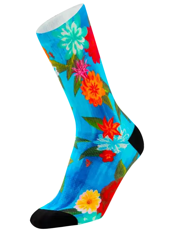 Vibrant floral cycling socks with blue background, colorful flowers, and black toe/heel for men or women
