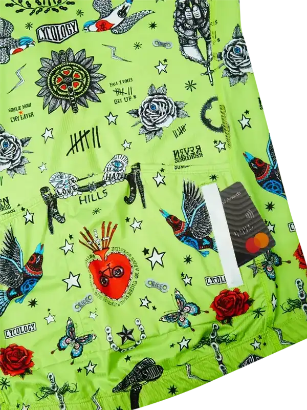 Vibrant green cycling jersey with tattoo-style graphics, roses, stars, and bold designs for men and women.
