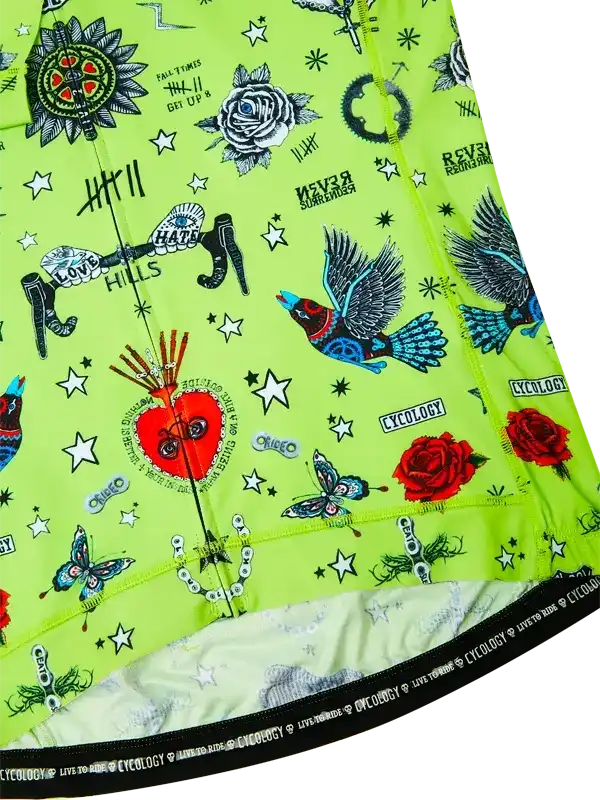 Vibrant green cycling jersey with tattoo-style graphics, roses, birds, and stars for men and women.