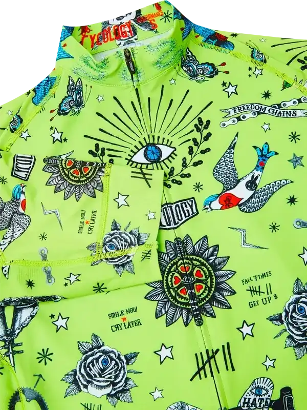 Vibrant green cycling jersey with tattoo-style graphics, roses, eyes, and stars for men's or women's rides.