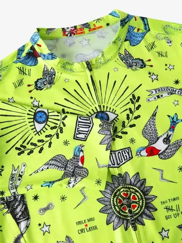 Vibrant neon green cycling jersey with tattoo-style graphics, butterflies, birds, and bold text designs