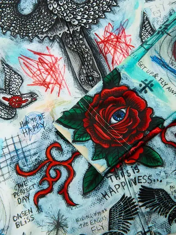 Artistic cycling jersey with red rose, eye, and tattoo-style graphics for men and women