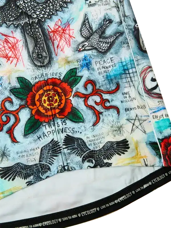 Men's cycling jersey with vibrant floral and bird tattoo-style graphics, bold text, and 'Cycology' waistband