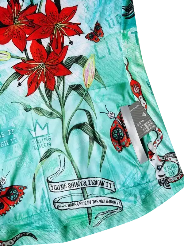 Mint green cycling jersey with red lilies, butterflies, and 'Cycling Queen' print for women's bike wear