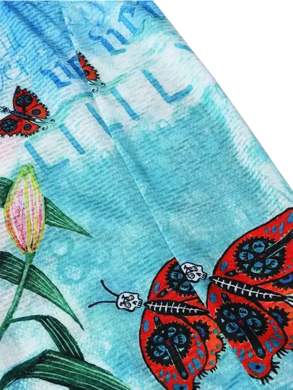 Vibrant butterfly and tulip design on cycling apparel fabric with blue watercolor background