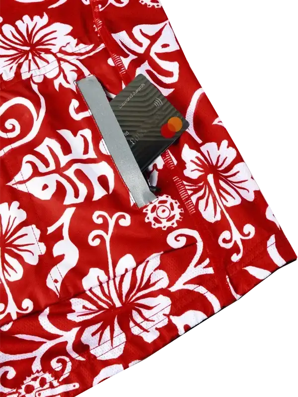 Red cycling shorts with white floral print and secure card pocket for on-the-go storage
