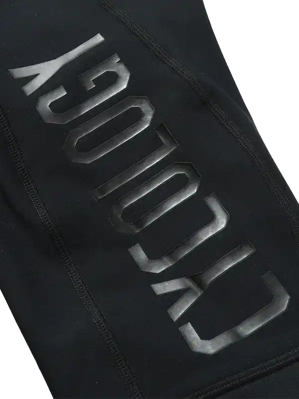 Black cycling apparel with bold 'CYCOLOGY' branding, high-quality fabric design