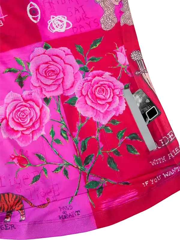 Pink floral cycling shorts with rose print, zip pocket, and tiger graphic for women's bike wear