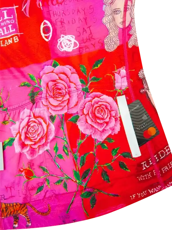 Vibrant pink and red cycling jersey with rose floral print, tiger graphic, and bold text design for women's bike wear.