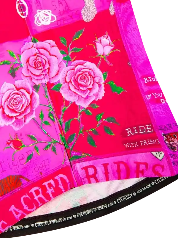 Pink cycling jersey with rose print and 'RIDE WITH FRIENDS' text, featuring vibrant floral design for women's bike wear.