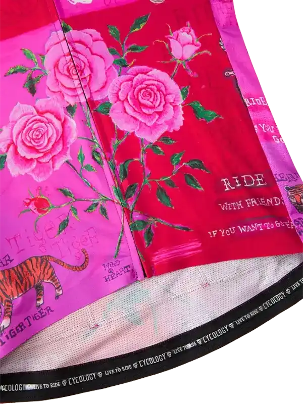 Vibrant pink cycling jersey with rose and tiger print, featuring 'Ride With Friends' text and mesh hem.