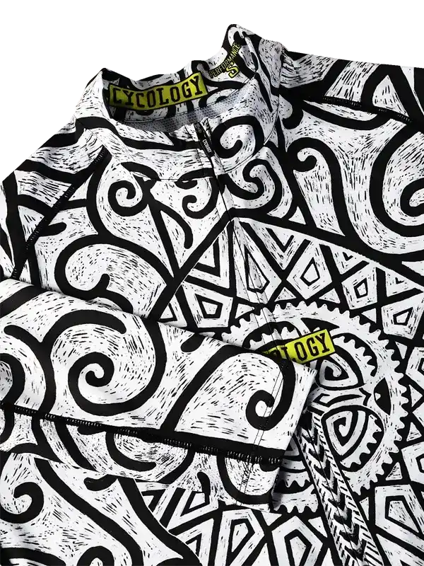 Men's cycling jersey with bold black and white abstract swirl pattern, featuring yellow 'CYCOLOGY' tag
