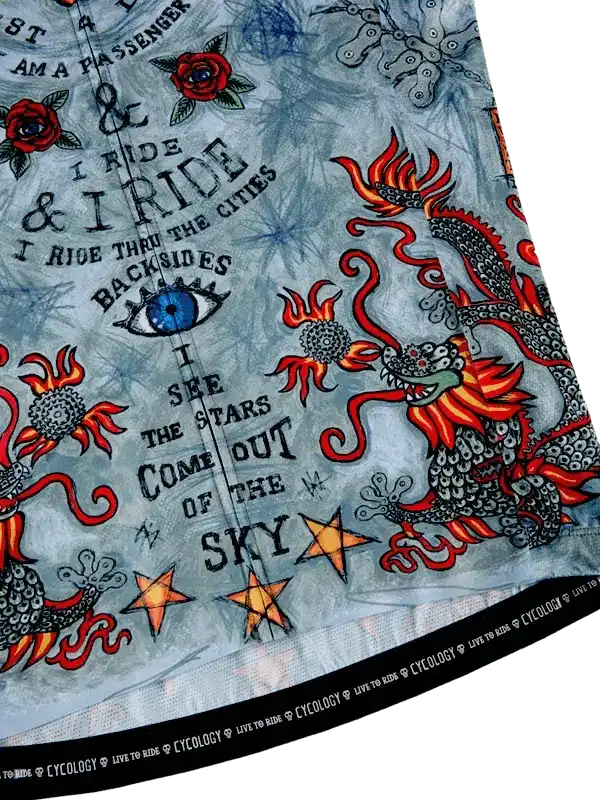 Men's cycling jersey with dragon, roses, stars, and bold text design on light blue fabric