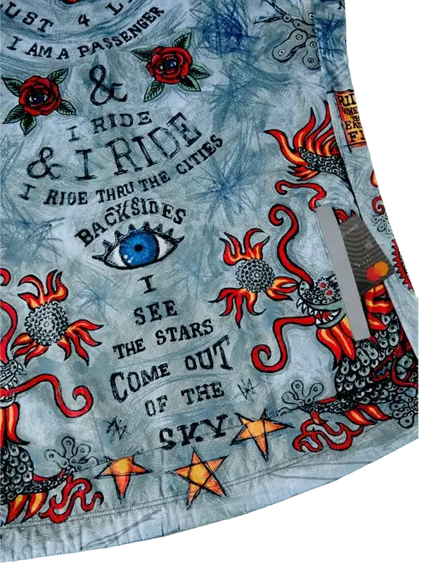 Men's cycling jersey with bold graphic print, red roses, dragon, stars, and cycling phrases on light blue fabric