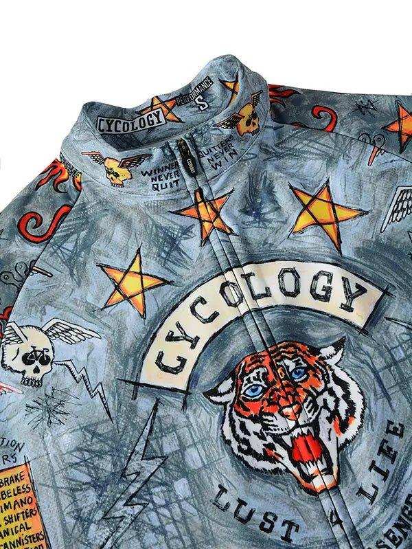 Cycology cycling jersey with tiger, stars, and skull graphics on blue fabric