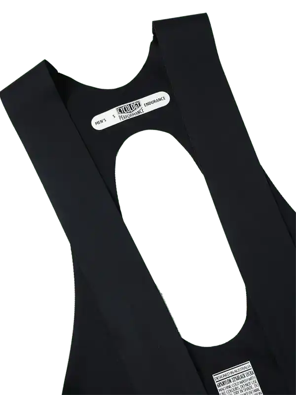 Men's black cycling bib shorts with performance endurance label, designed in Australia