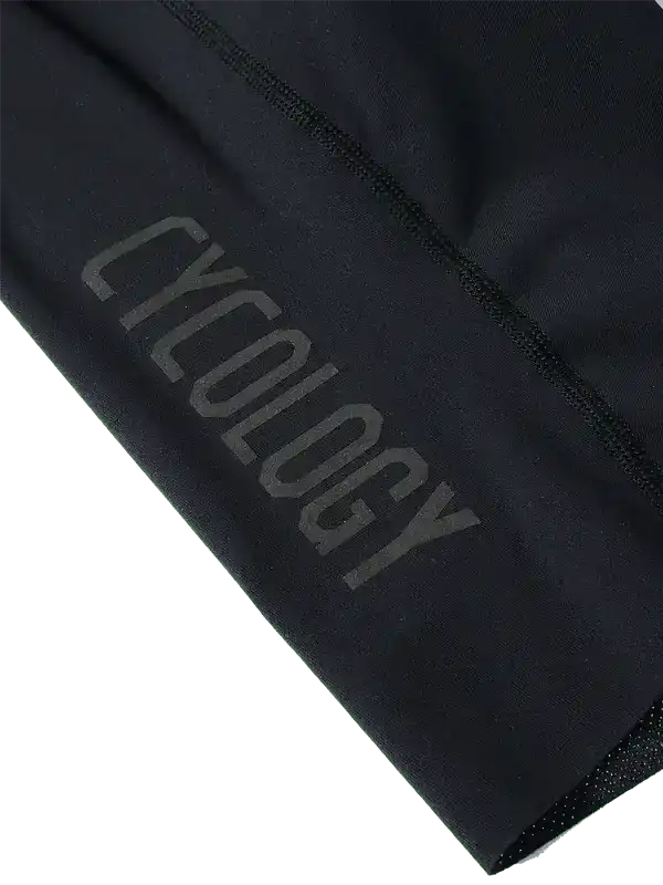 Black cycling shorts with subtle 'CYCOLOGY' branding, high-quality fabric for men's and women's bike wear