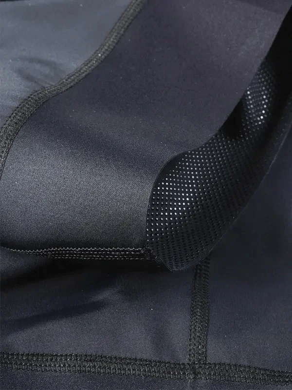 Black cycling shorts with breathable mesh panel and flatlock seams for comfort