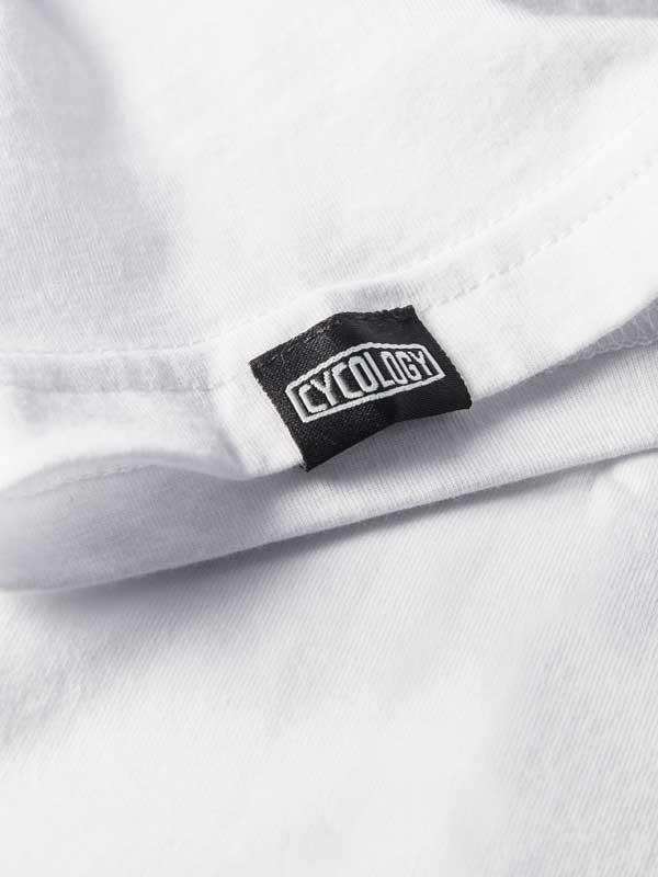 White cycling jersey with black Cycology brand tag, showcasing high-quality fabric detail for men's and women's apparel.