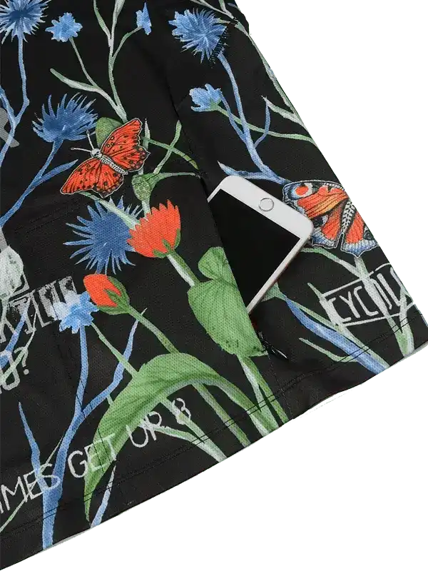 Black cycling shorts with floral and butterfly print, featuring phone pocket and 'CYC' logo detail.