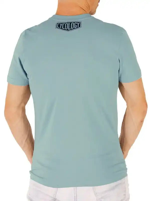Men's light blue cycling t-shirt with 'CYCOLOGY' logo on back, casual fit for active wear