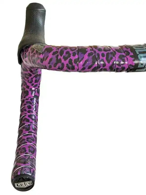 Purple leopard print bike handlebar tape with black grip, stylish cycling accessory for road bikes