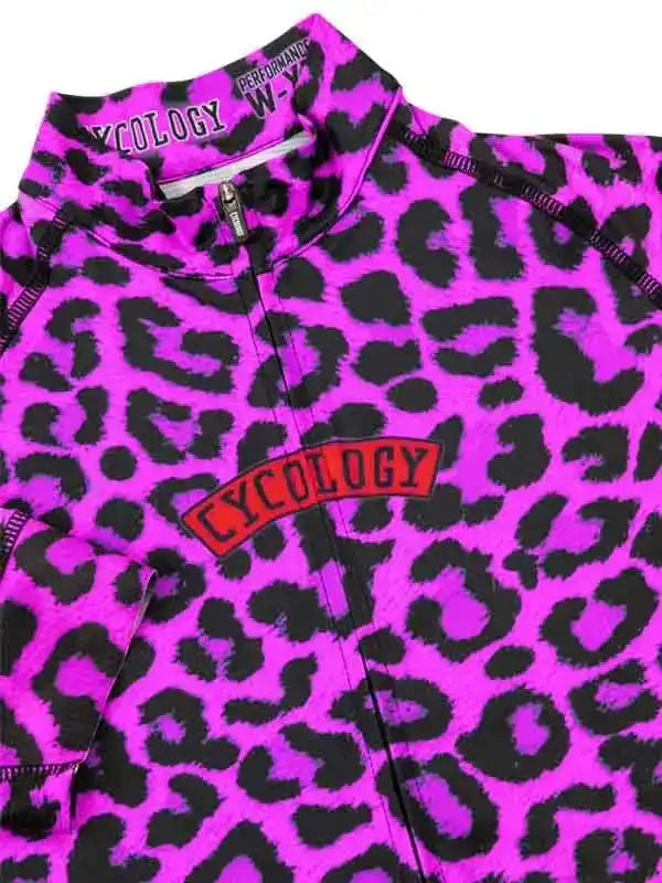 Vibrant pink leopard print women's cycling jersey with bold Cycology logo and performance zipper detail