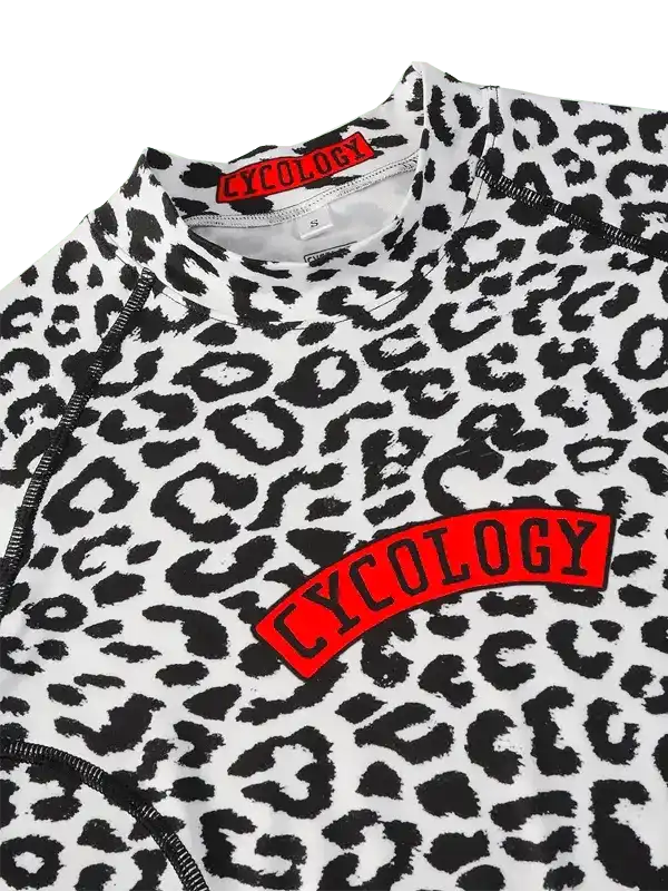 Women's leopard print cycling jersey with red Cycology logo, high-quality fabric, stylish design