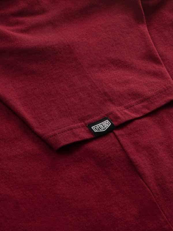 Maroon cycling jersey with Cycology brand tag, soft fabric detail for men's and women's bike wear