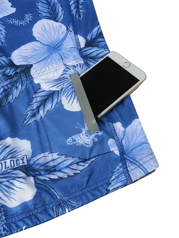Blue floral cycling shorts with phone pocket, featuring hibiscus print and secure storage for rides.