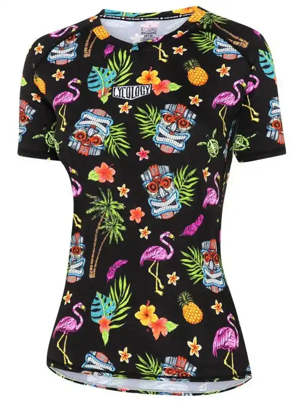 Women's tropical print cycling jersey with flamingos, pineapples, and tiki masks on black fabric