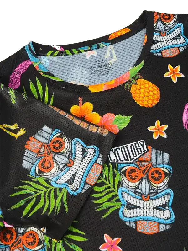 Black cycling jersey with tropical tiki mask, pineapple, and hibiscus print for men and women