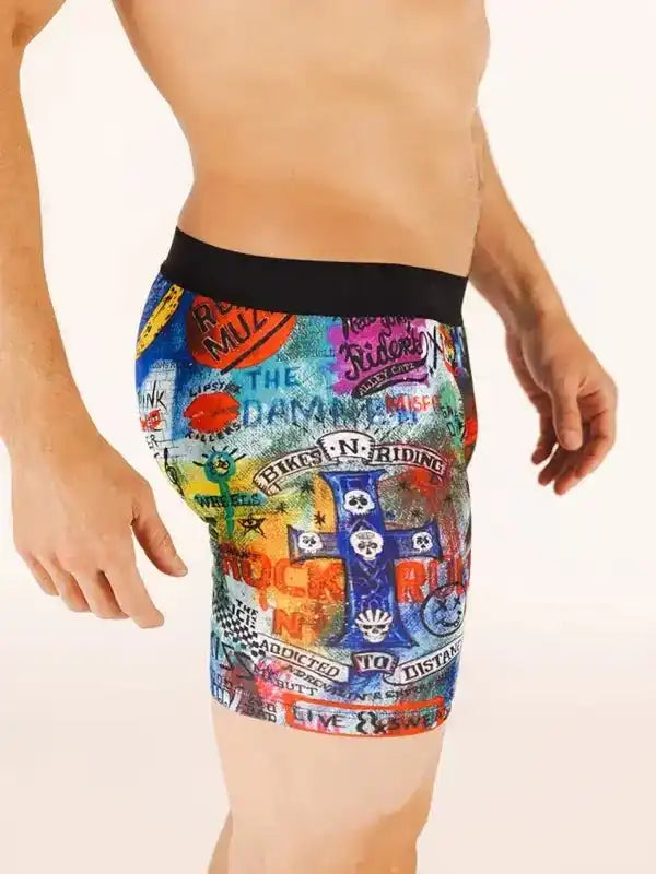 Men's colorful cycling shorts with bold graphic print and black waistband, designed for comfort and style on rides.