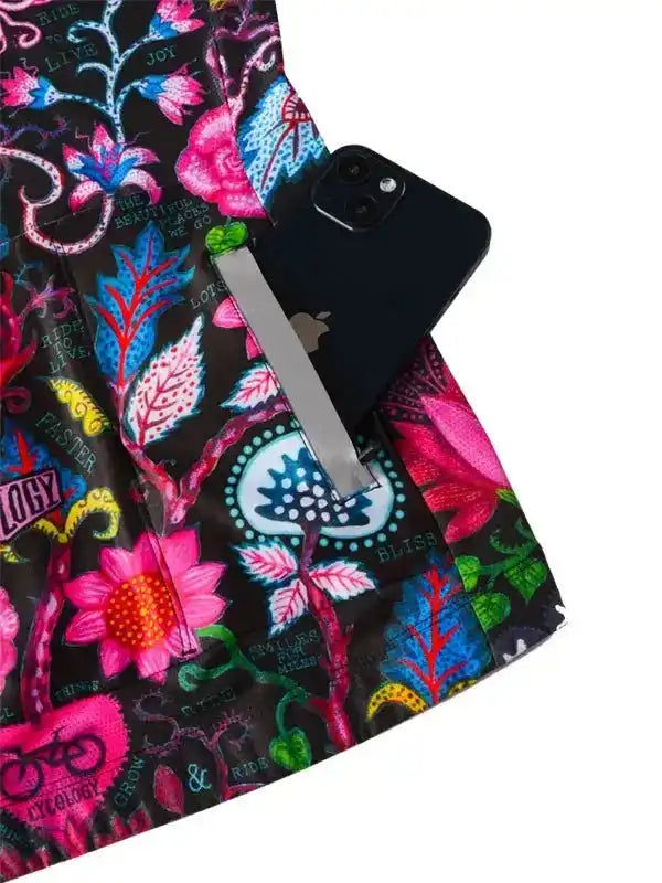 Colorful floral cycling shorts with phone pocket, vibrant print, and secure zippered storage for rides.