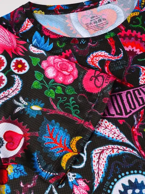 Vibrant floral and graphic print cycling jersey with bold colors and unique design details