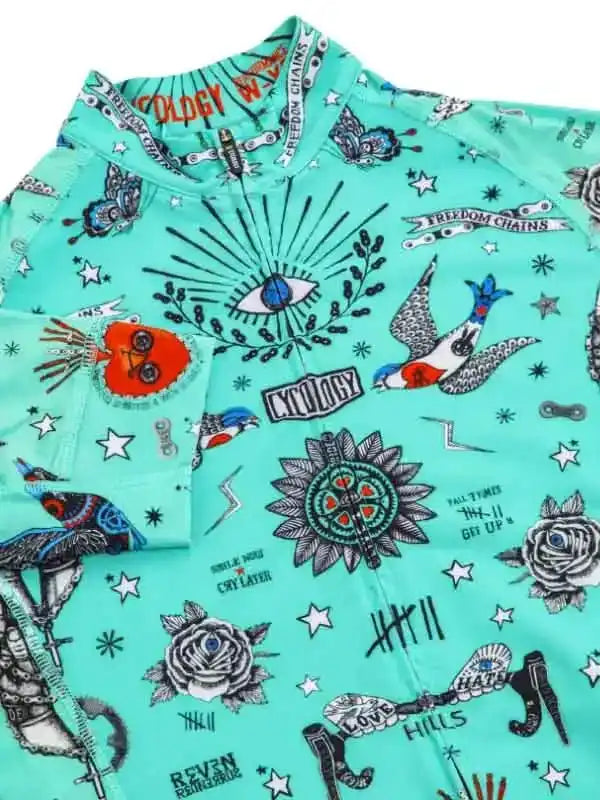Mint green cycling jersey with tattoo-style graphics, roses, birds, and eye design for men and women