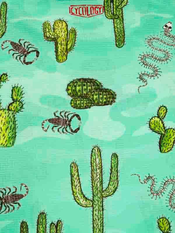 Cactus and scorpion pattern on teal cycling apparel fabric