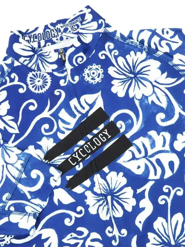 Blue cycling jersey with white floral pattern and Cycology branding, performance fabric