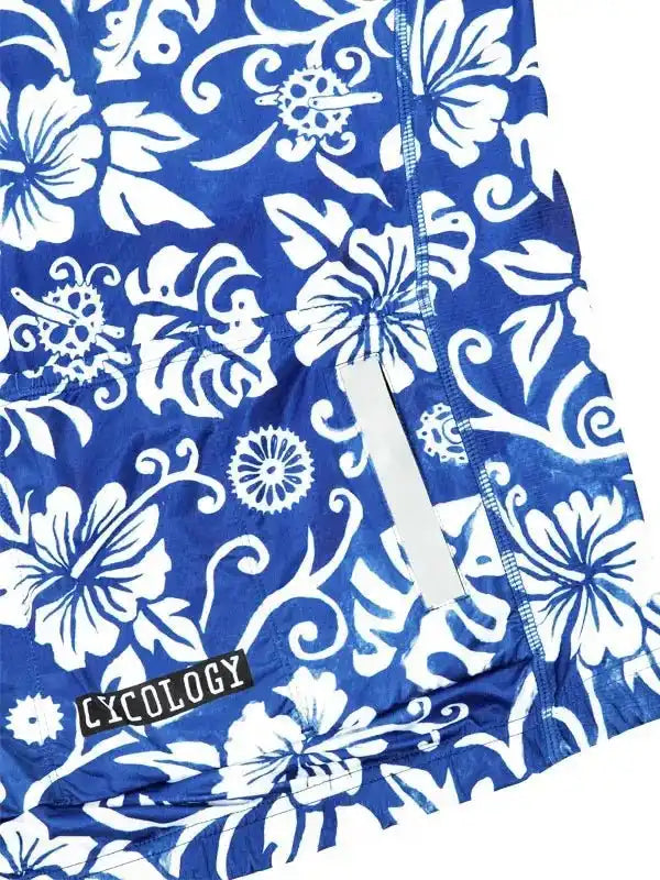 Blue cycling jersey with white floral and gear pattern, featuring reflective strip and 'CYCOLOGY' logo