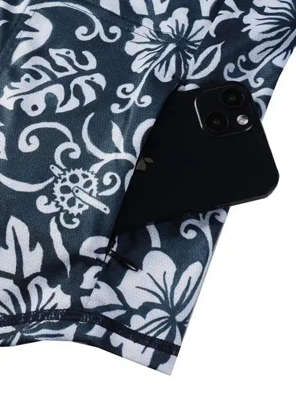 Cycling jersey with floral pattern and rear pocket holding smartphone, ideal for men's and women's rides