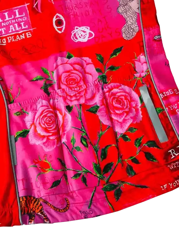 Vibrant red cycling jersey with pink roses, tiger print, and bold text graphics for women's bike wear