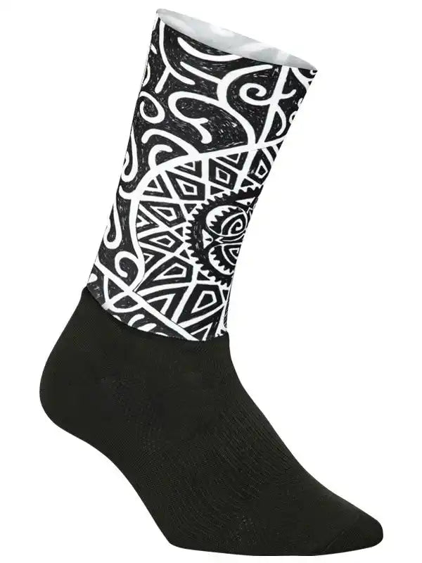 Black cycling sock with bold white geometric and tribal pattern, designed for men's and women's bike rides