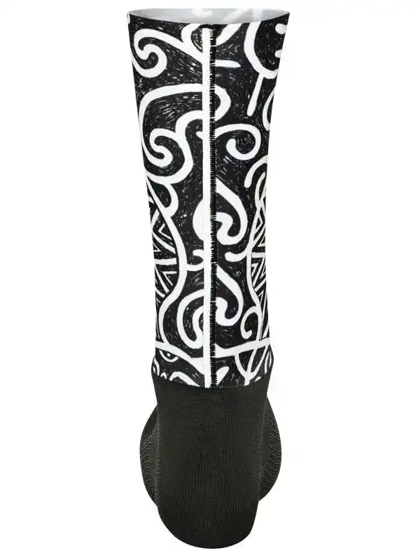 Black and white patterned cycling sock with swirl design and ribbed cuff for comfort and style