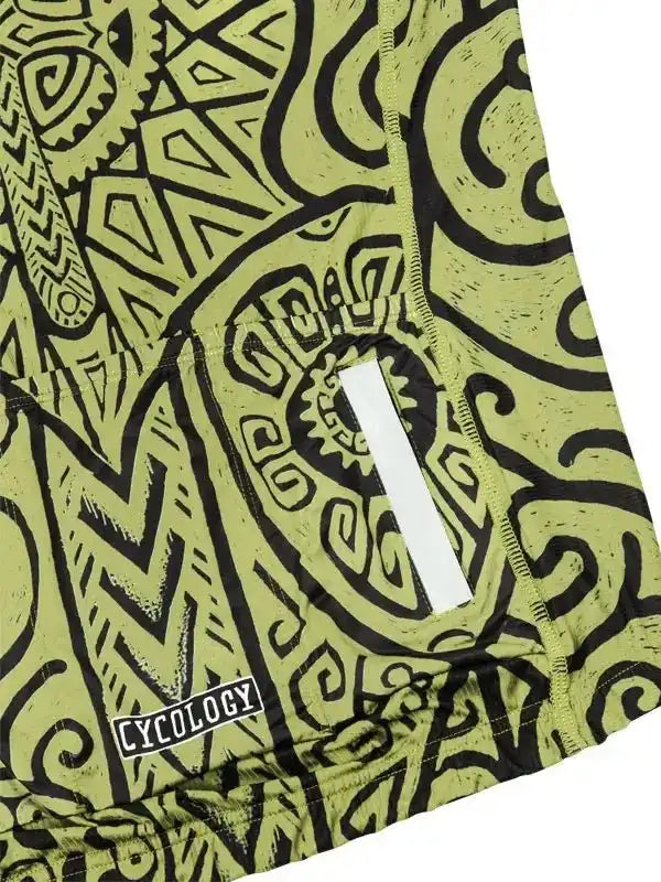 Green cycling jersey with bold black tribal print and reflective stripe, featuring Cycology brand tag